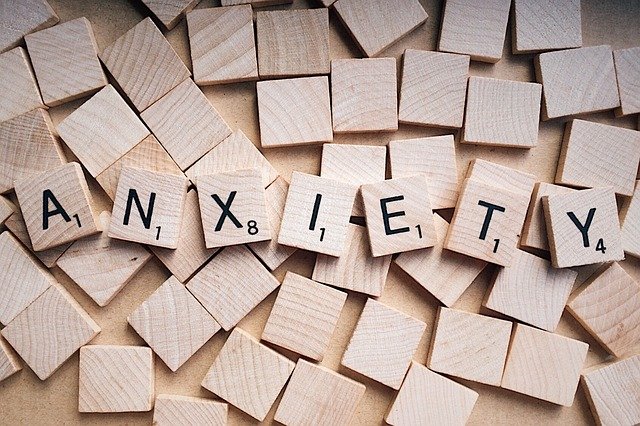 Scrabble letters showing anxiety spelled out