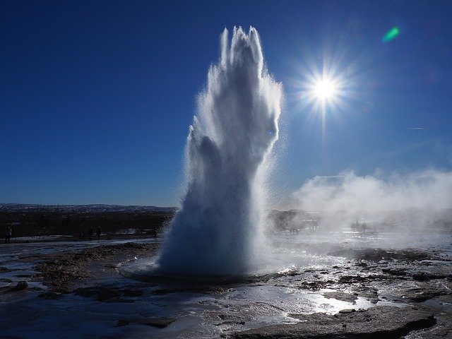 A picture of a spring geyser shooting water from deep below the ground