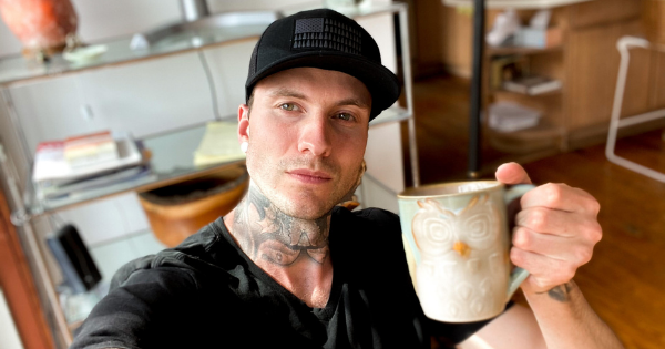 Jakob Roze drinking a cup of coffee as it relates to drinking coffee before a workout and anxiety