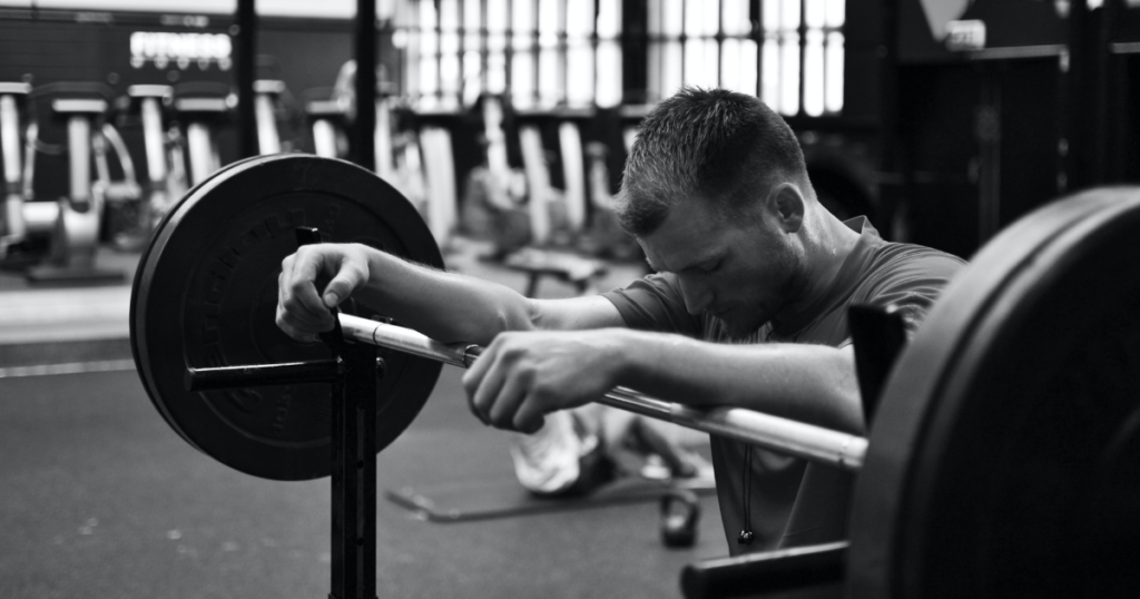 A picture of a person lifting weights to show the importance of exercise for PTSD