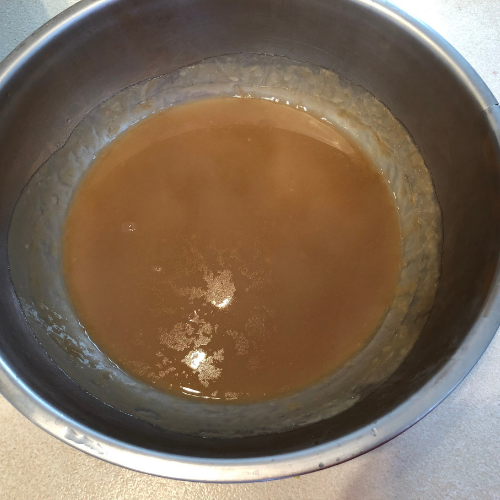 Rice Flour Slurry cooling down in a large metal bowl 