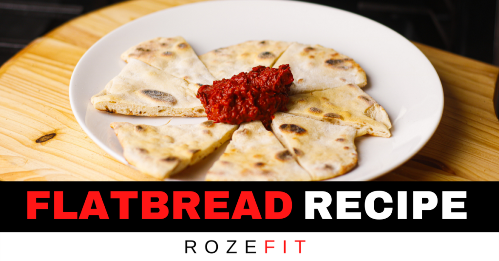 A picture of low calorie healthy flatbread and a side of bright red harissa dipping sauce with text that reads "flatbread recipe"