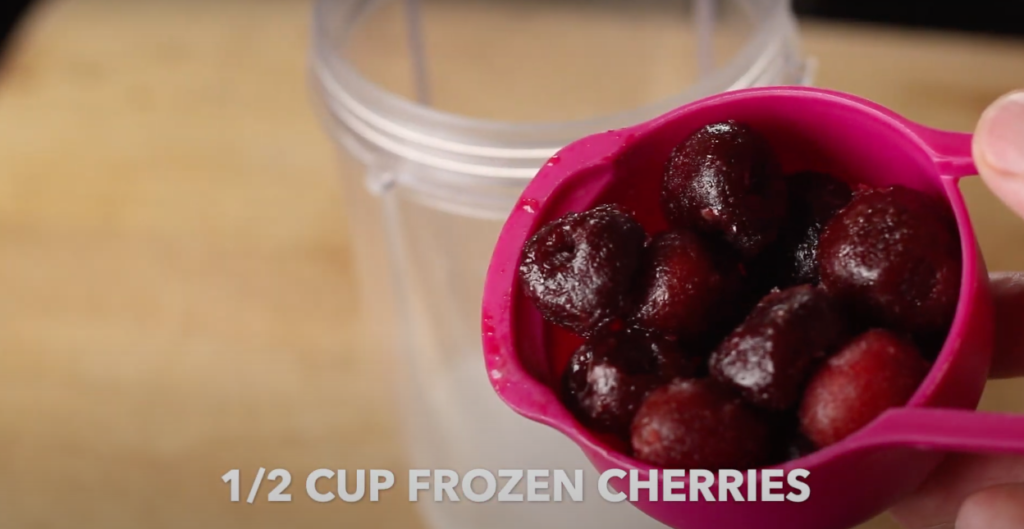 A half a cup of frozen cherries with text that reads 1/2 cup frozen cherries