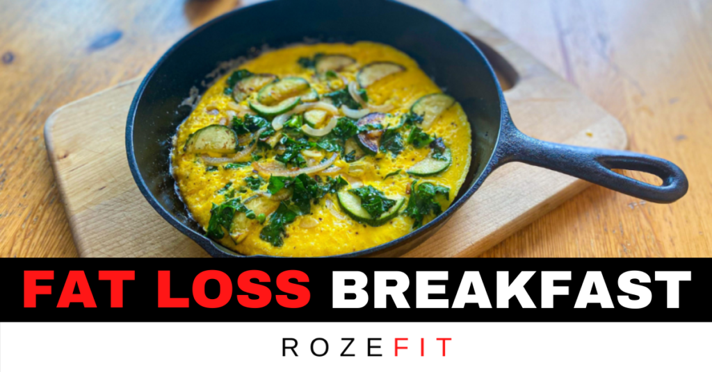 A picture of a healthy breakfast for weight loss. A massive veggie omelet in a cast iron pan with text underneath that reads "fat loss breakfast"