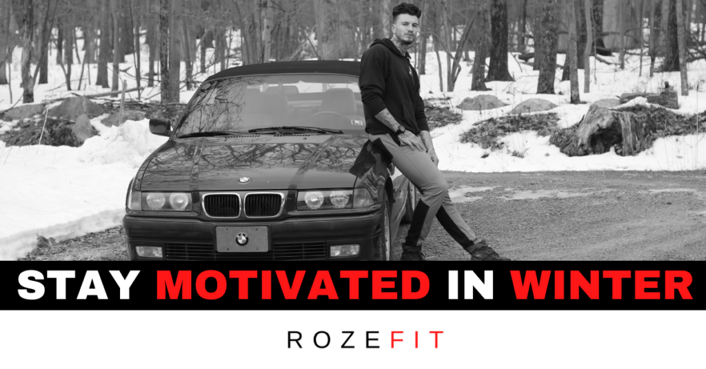 Text that reads 'stay motivated in winter' and a personal trainer sitting next to his bmw car in winter time.
